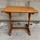 Small side table or bistro serving table with curved wood.