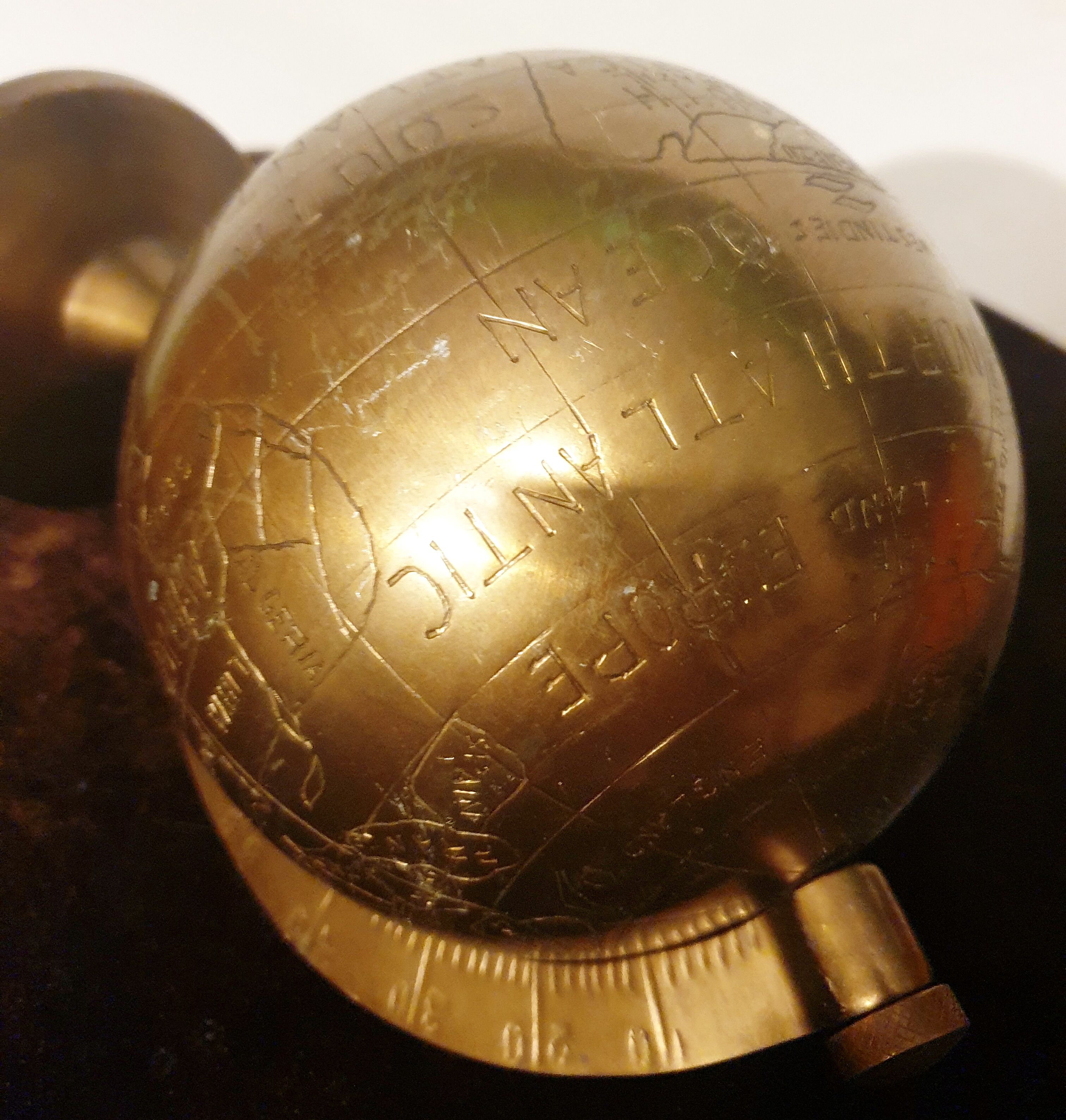 Old terrestrial globe in copper, brass