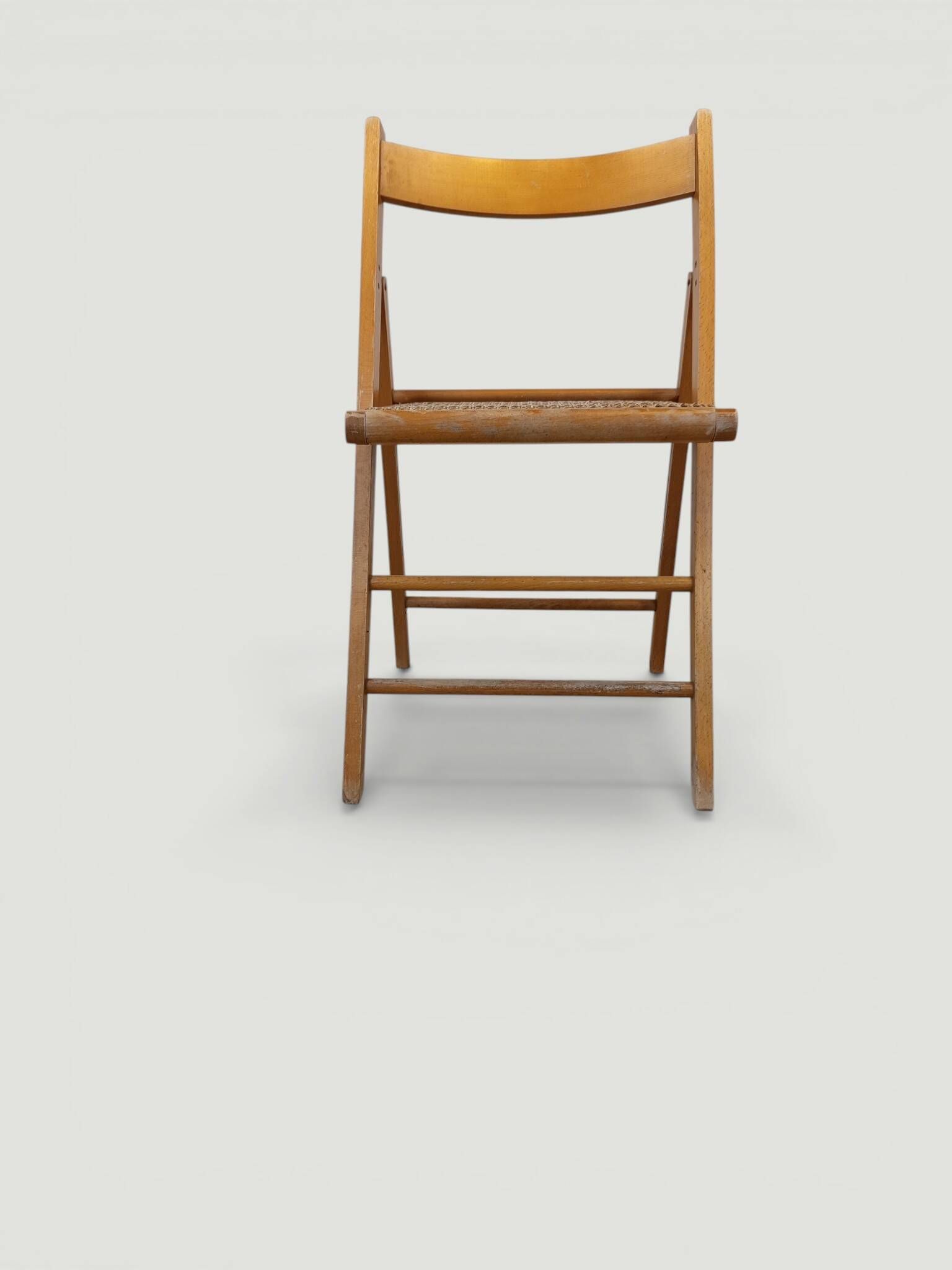 Vintage folding chair with caning.