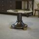 Neo-classical cast iron and glass eglomisé coffee table from the 1940s.