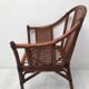 Rattan armchair with its footrest 70s