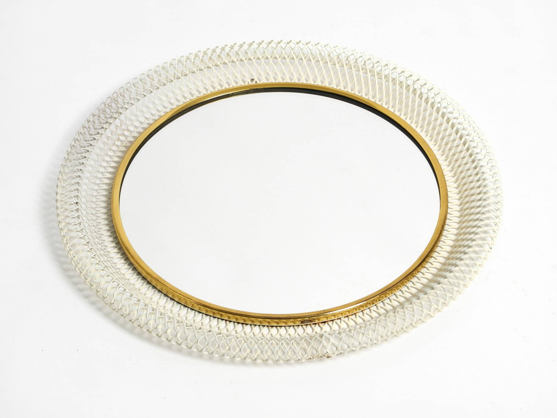 Pair of Mid Century wall mirrors with brass rim and white metal frames