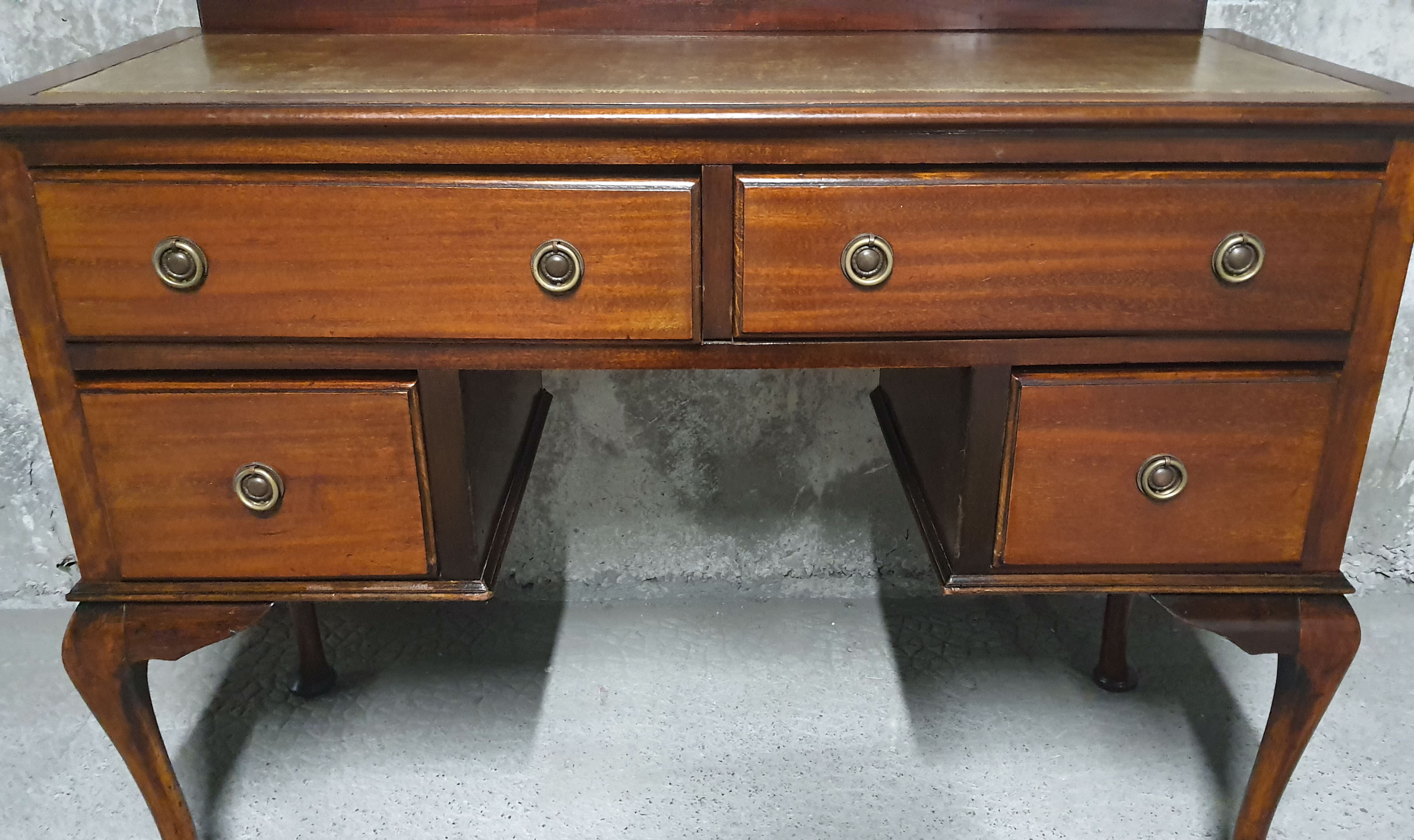 Old desk in cherry and green leather