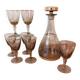 Vintage liqueur service, carafe and 7 amber brown glasses with gold edging