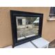 Black lacquered wood mirror "originally punctured"