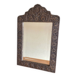 Ancient oriental mirror in embossed copper