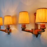 Pair of two-armed art deco "ball" wall lights, carved wood, France, 1960