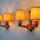 Pair of two-armed art deco "ball" wall lights, carved wood, France, 1960