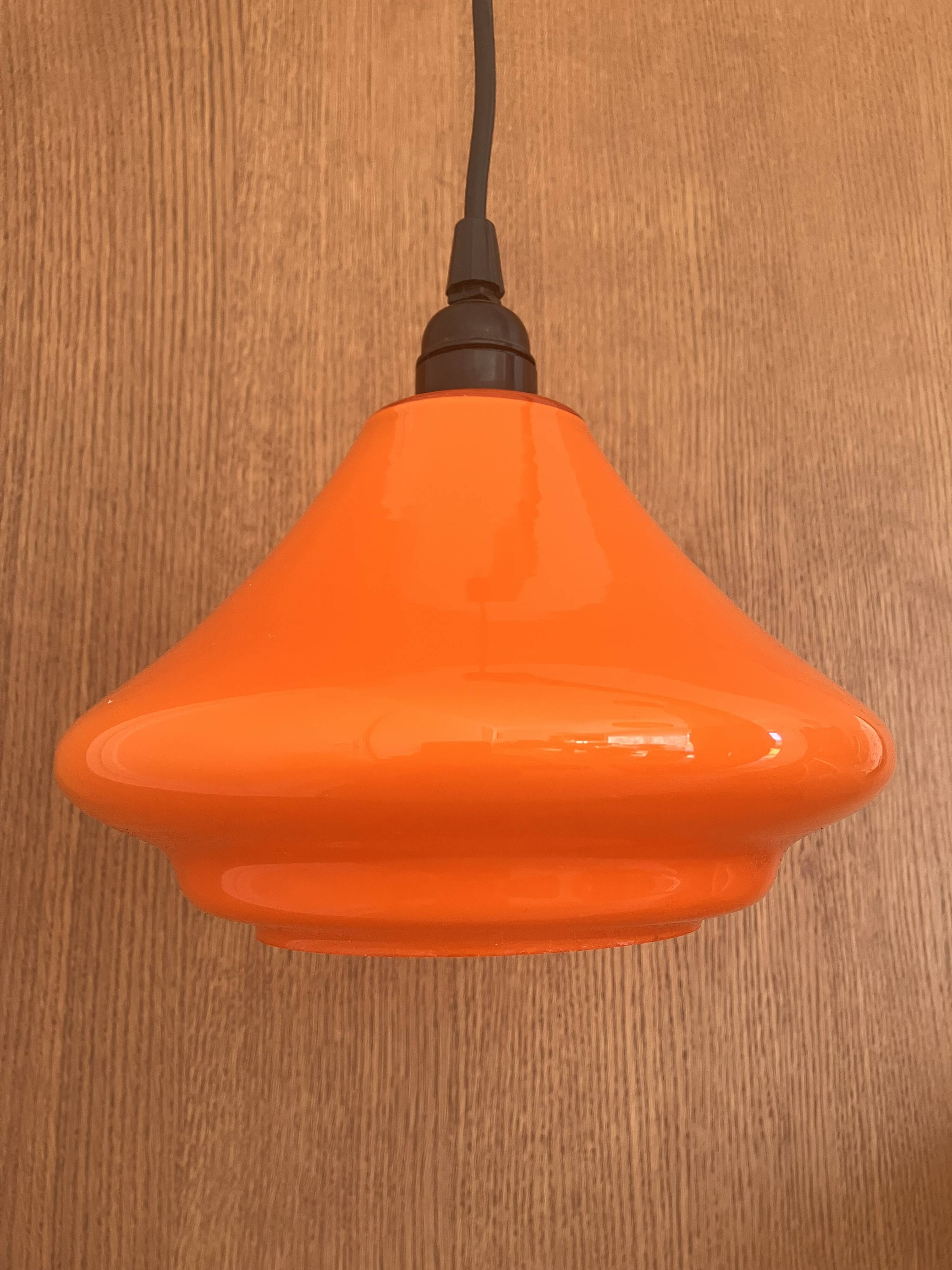 Set of three orange opaline suspensions from the 1970s Space Age.