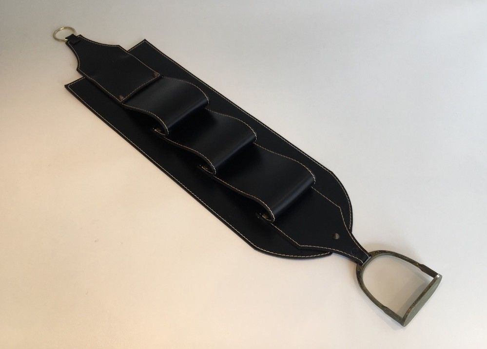 Leather wall-mounted magazine rack. Attributed to Jacques Adnet