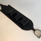 Leather wall-mounted magazine rack. Attributed to Jacques Adnet