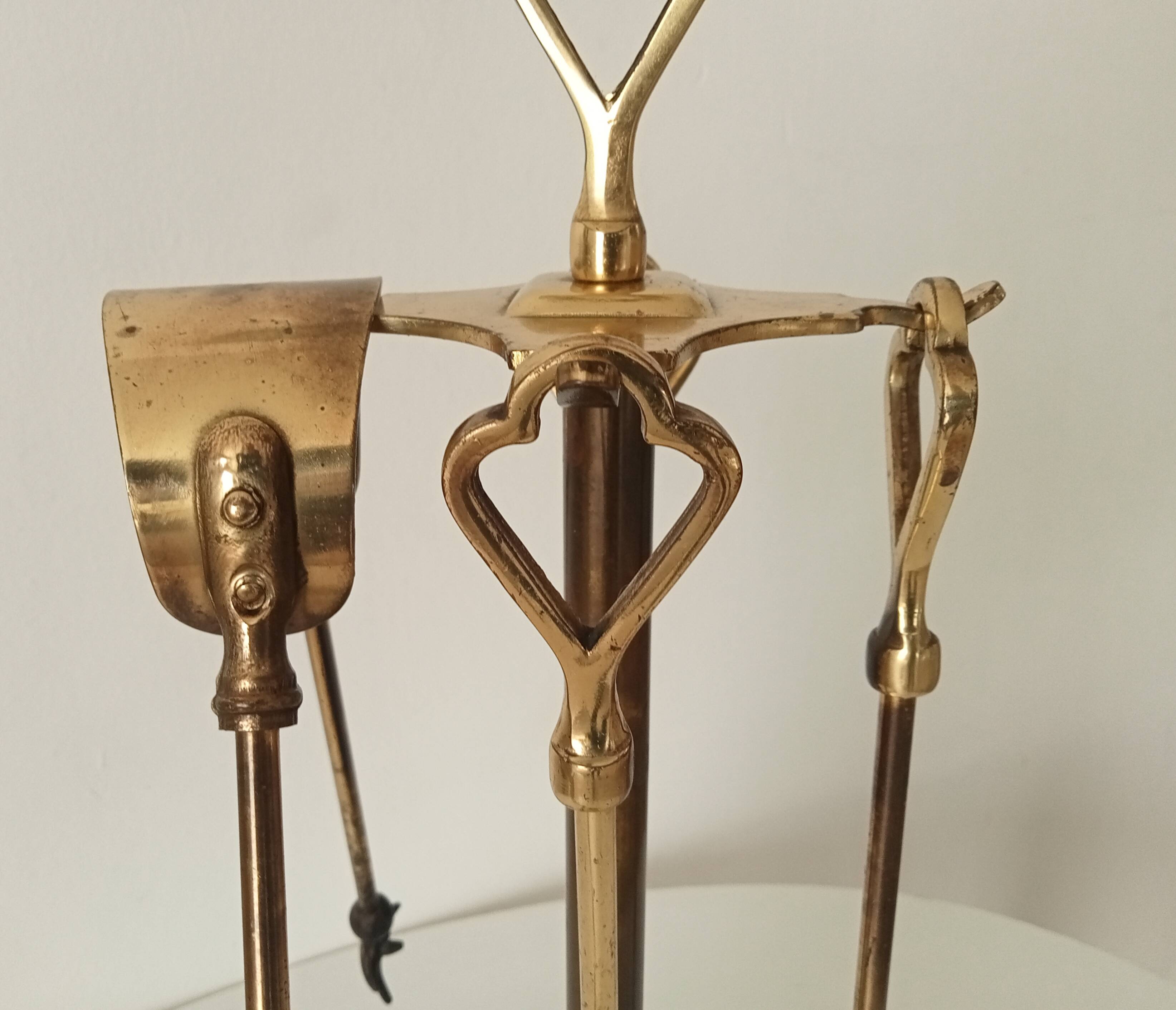 Old brass fireplace servant