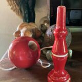 Large red wooden cup-and-ball game, 9 cm in diameter.