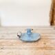 Blue enameled sheet metal candle holder