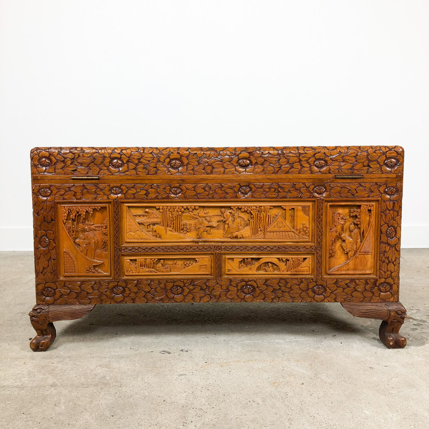 Vintage Chinese carved camphor wood chest on claw feet