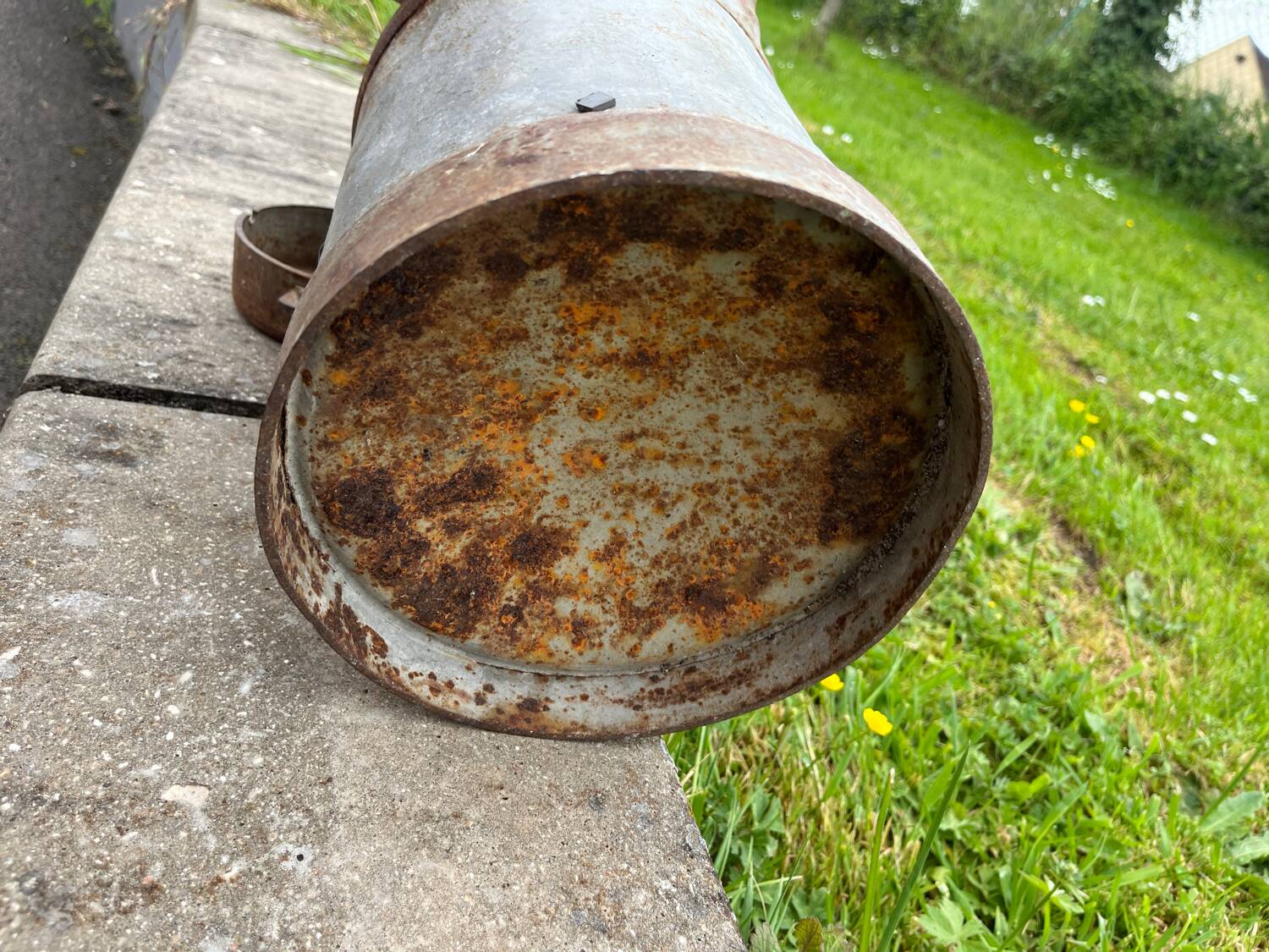 Old metal can or milk jug
