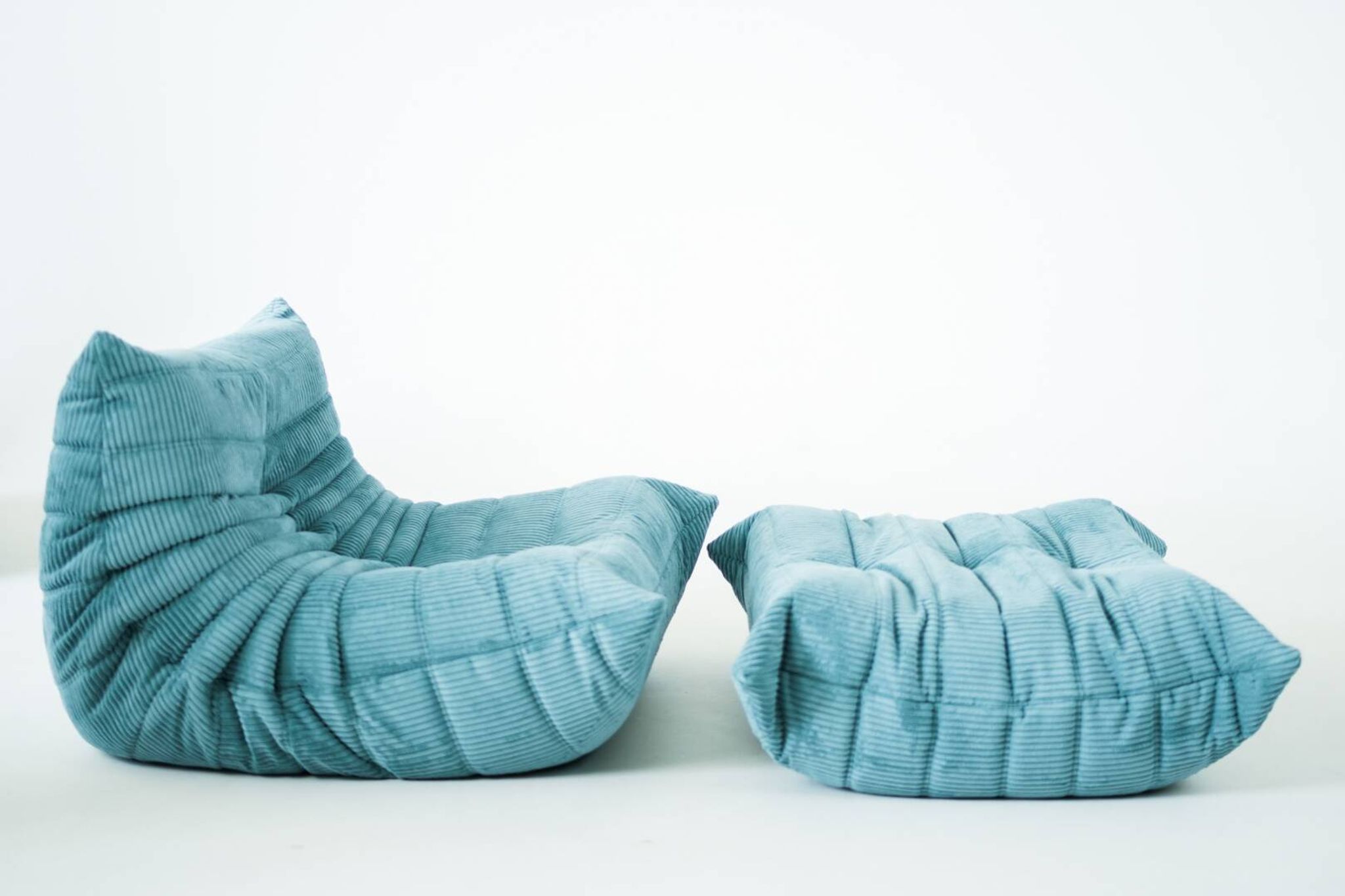 Togo set of armchair and pouf in light blue corduroy