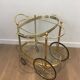 Oval brass trolley from Maison Baguès.