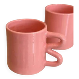 Ceramic mug with wave handle