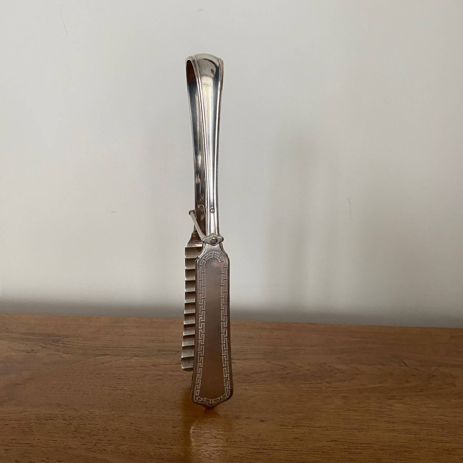 Silver asparagus tongs with Minerva hallmark, 19th century