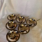 Set of 6 stainless steel ice cream bowls by Guy Degrenne with matching spoons.