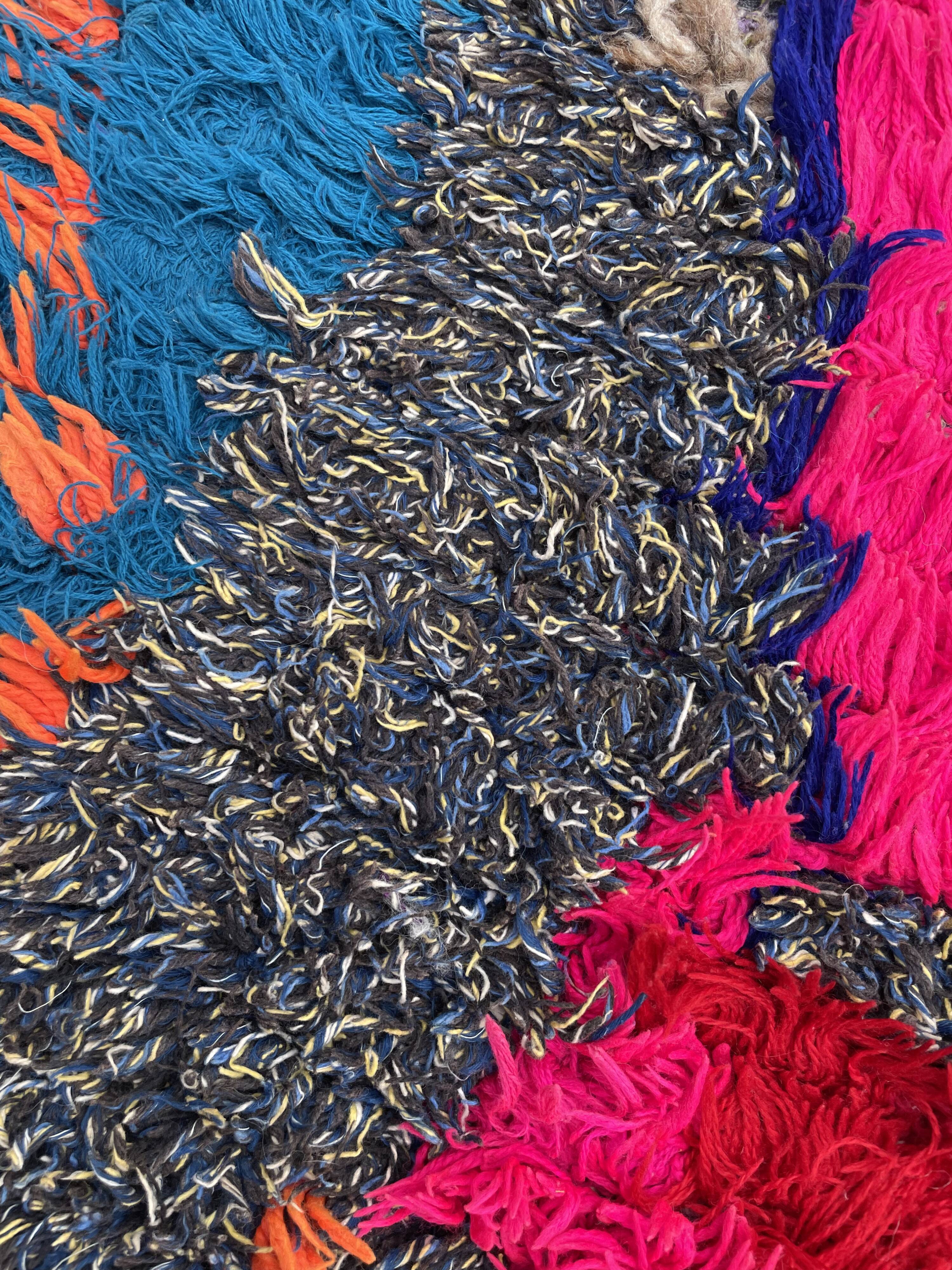 Modern red berber carpet in boucherouite fabrics