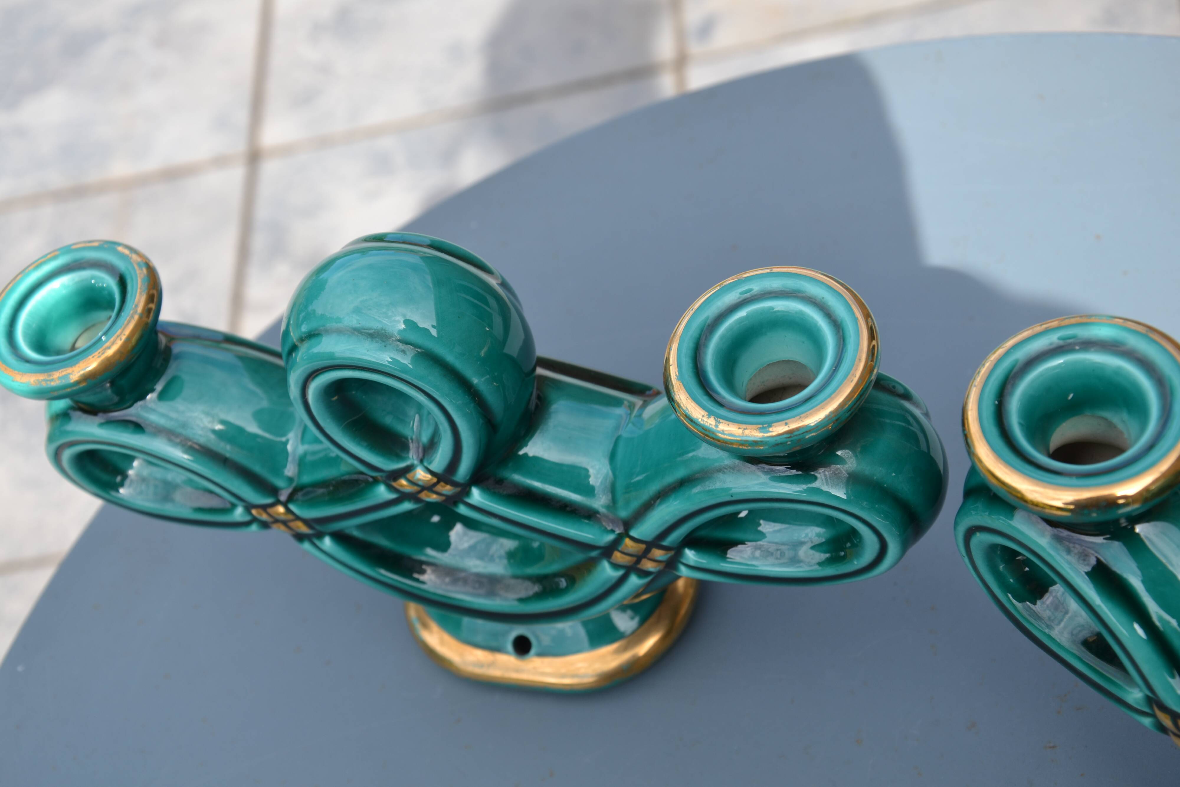Two green ceramic candlesticks from the 1930s-1940s.