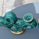 Two green ceramic candlesticks from the 1930s-1940s.