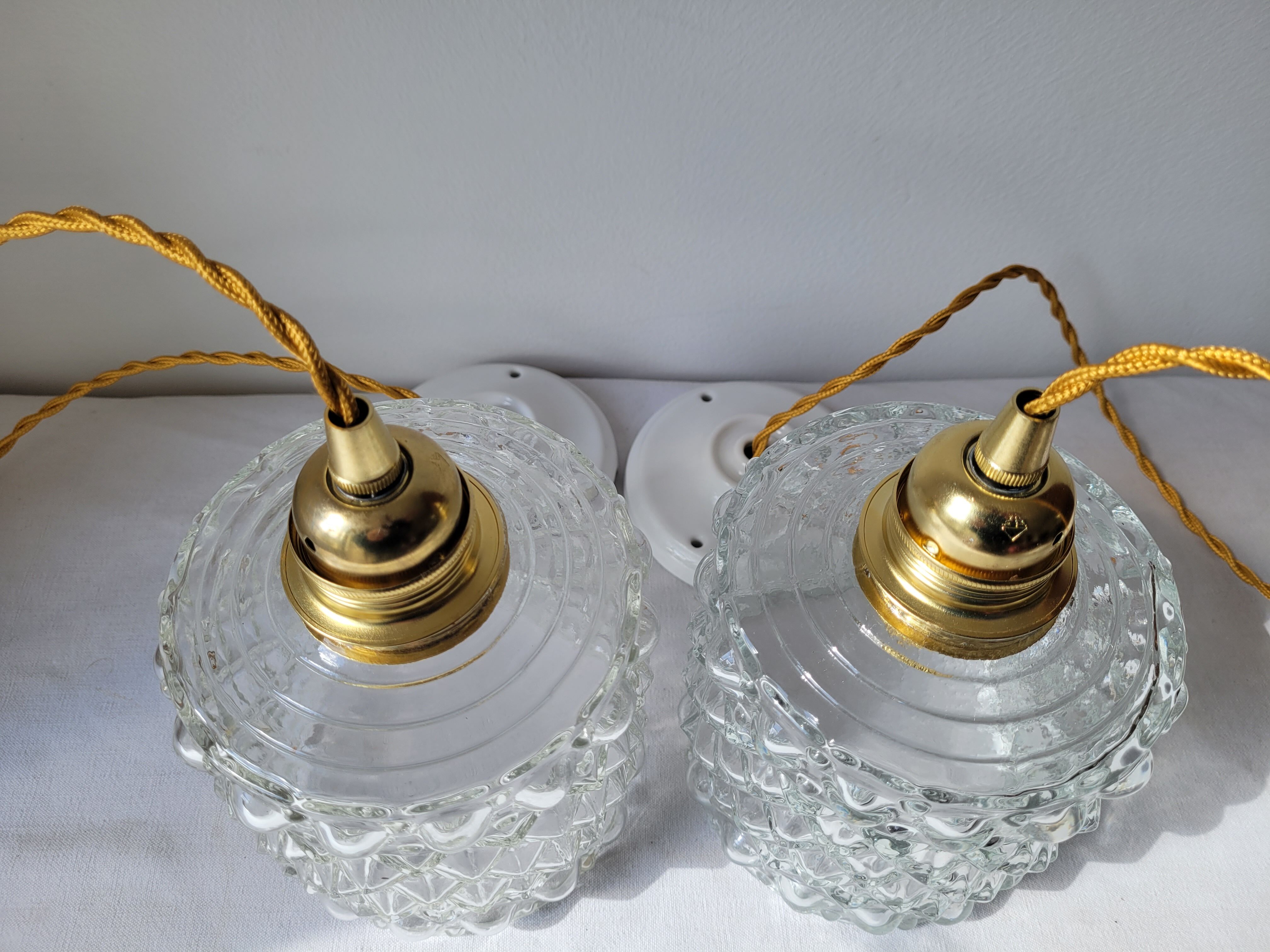 Duo of molded glass pendant lights