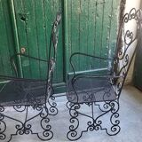 Pair of black wrought iron armchairs