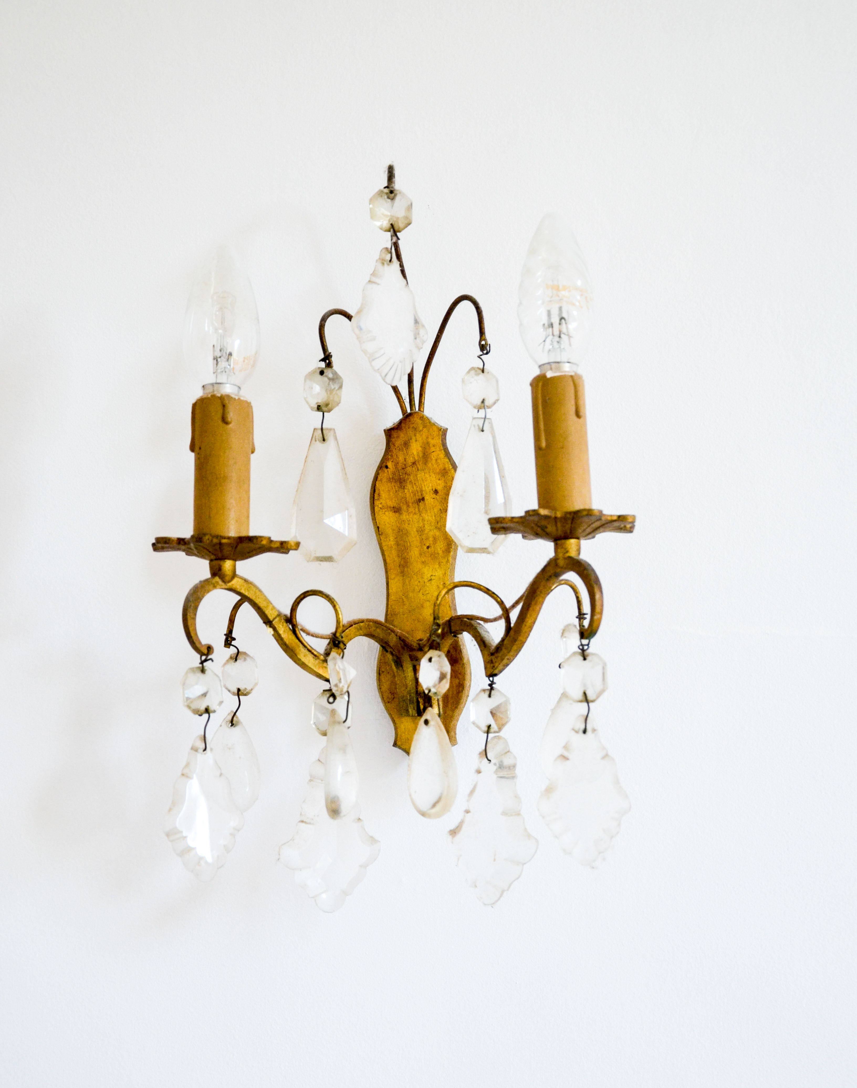 Pair of golden sconces with tassels