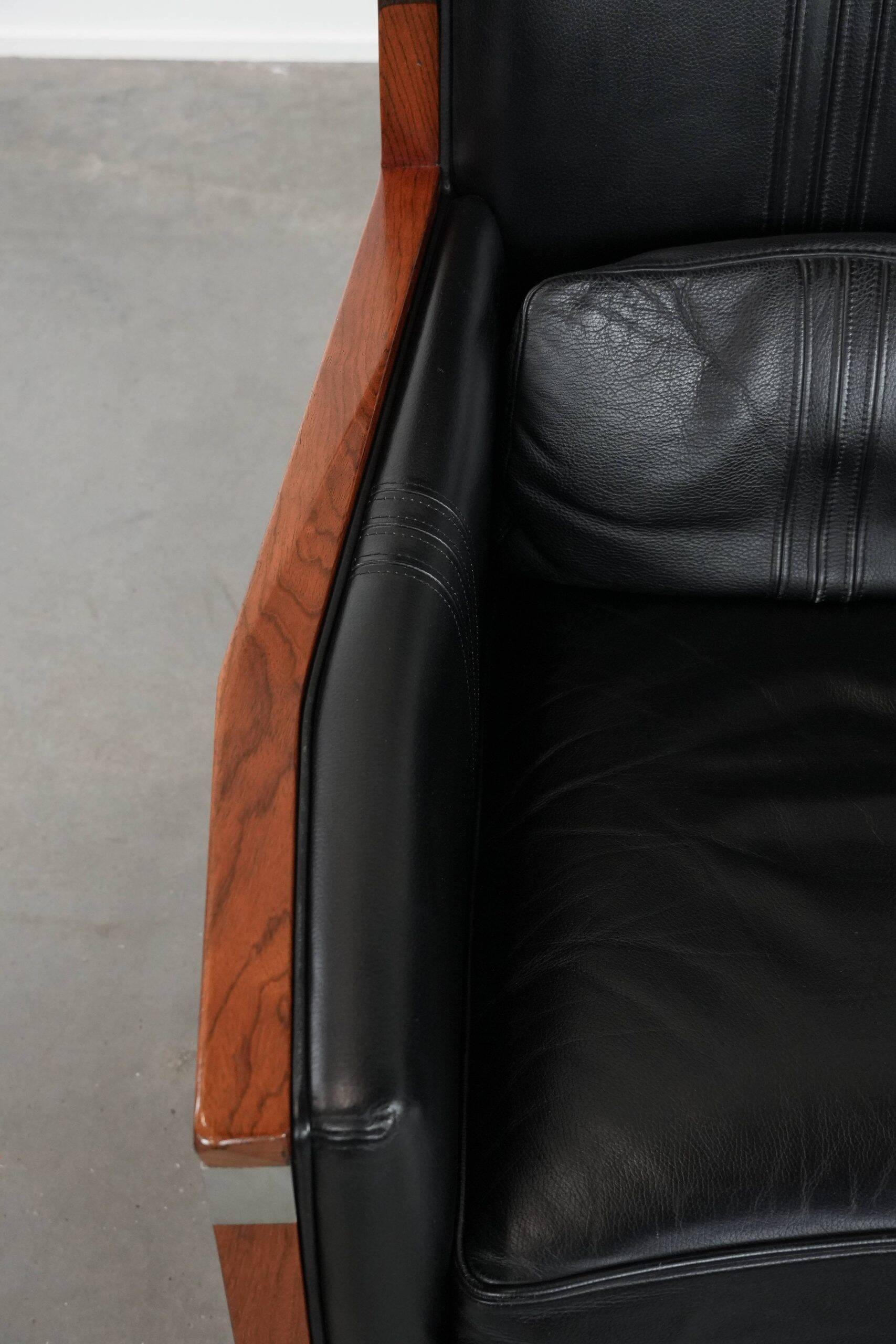 Beautiful and very comfortable black Art Deco design armchair