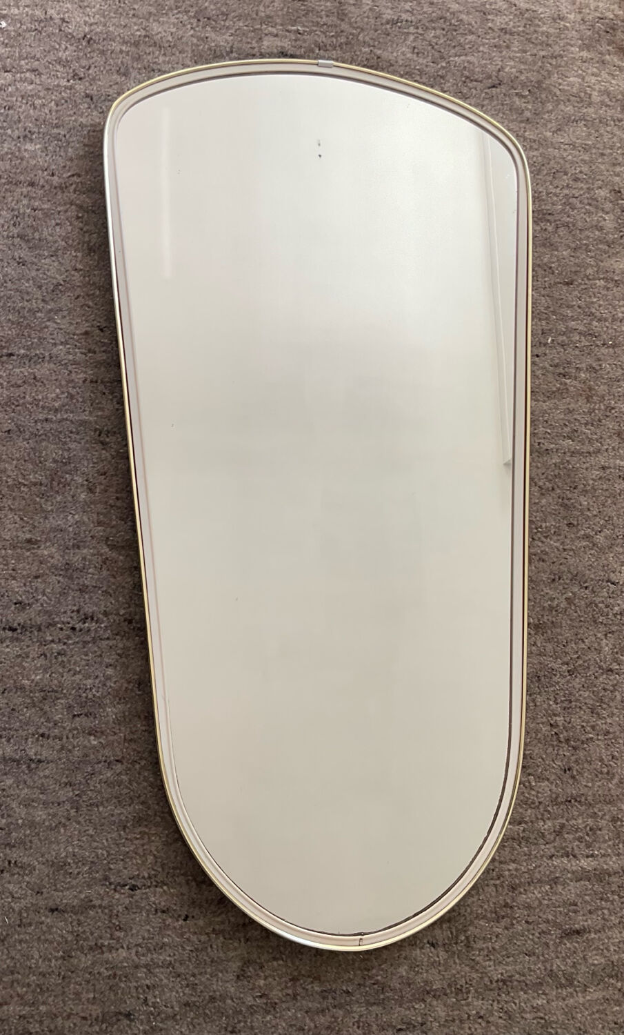Asymmetrical free-form mirror from the 60s-70s.