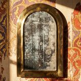 Large vintage Moroccan artisan wall mirror from the 50s-70s, made of solid brass, arch-shaped.