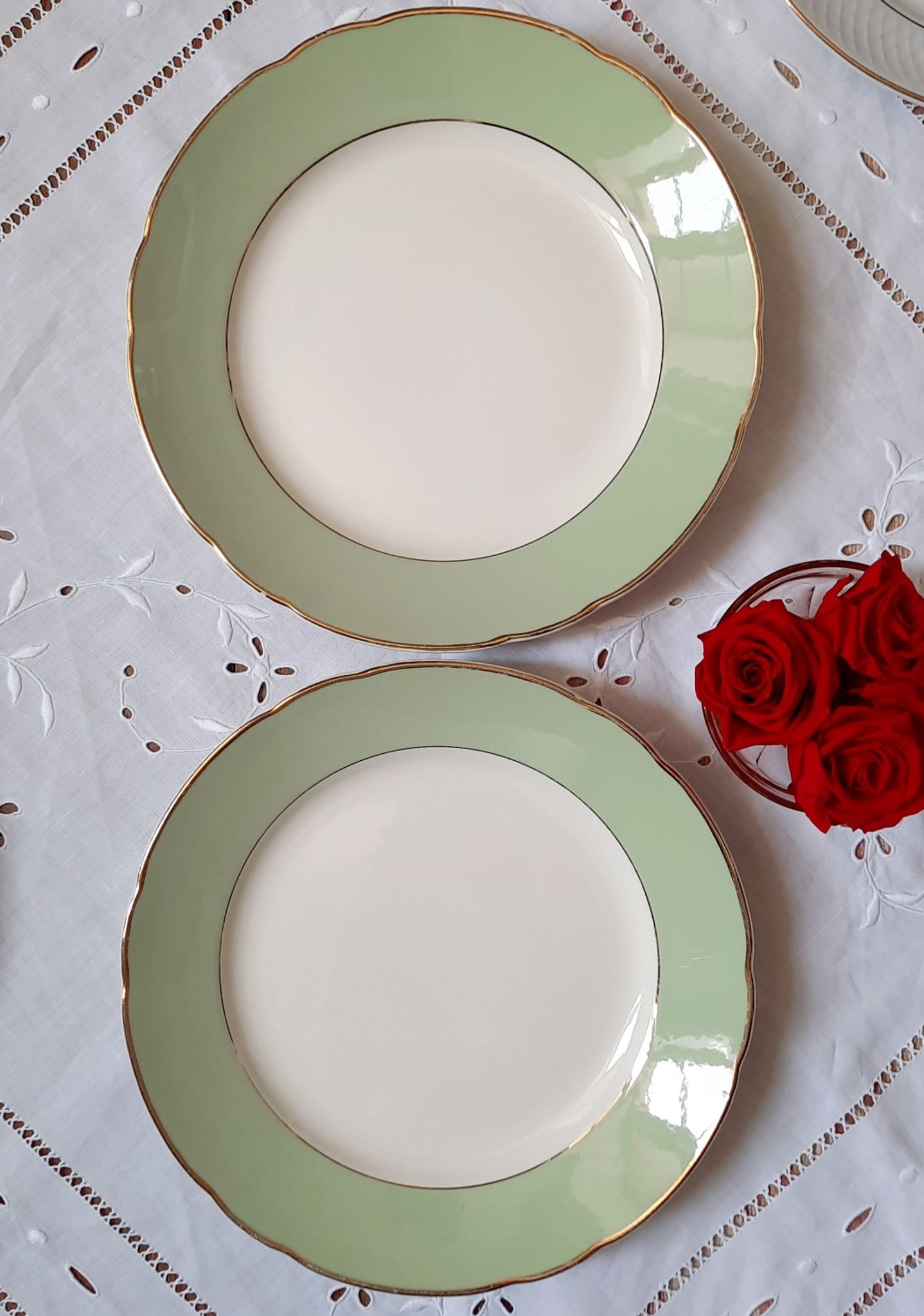 Flat antique earthenware plates with gilded edges