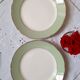 Flat antique earthenware plates with gilded edges