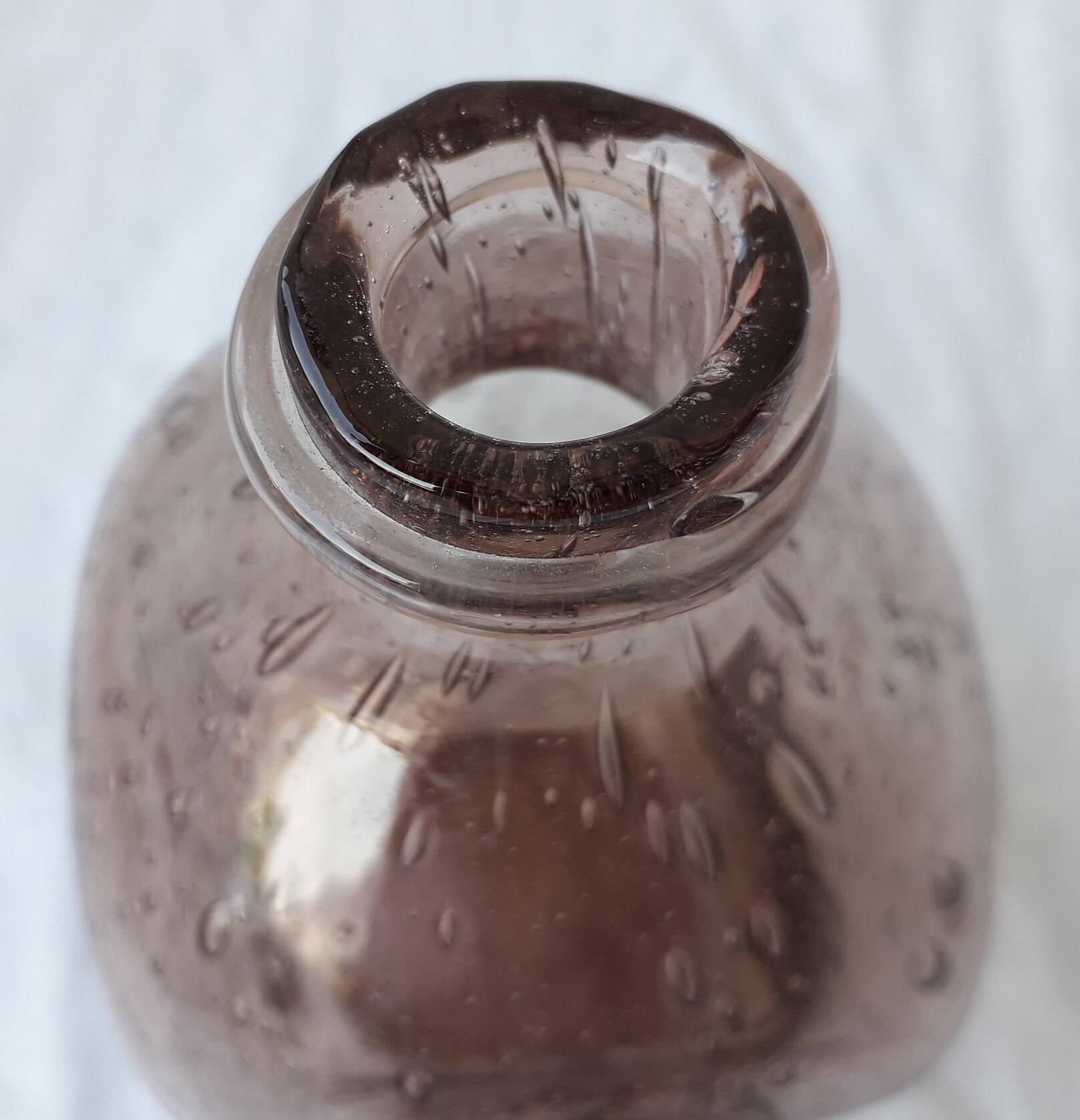 Biot bottle in bubbled glass