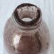 Biot bottle in bubbled glass