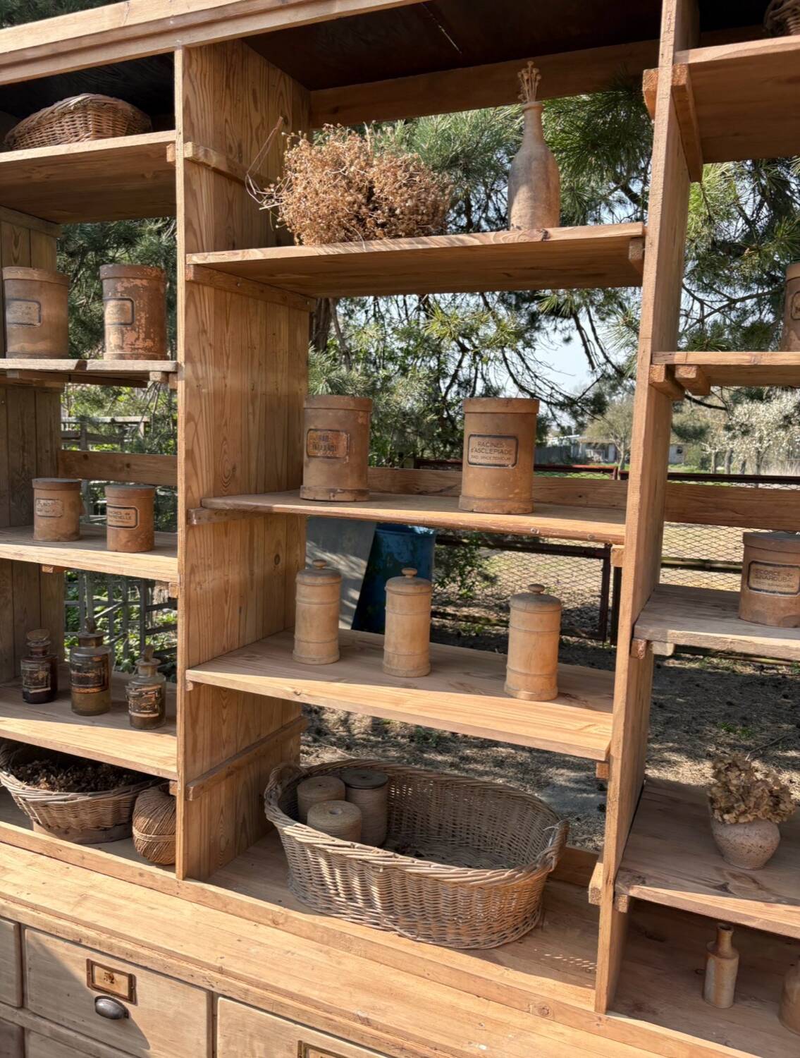 Large antique workshop furniture with drawers and shelves.