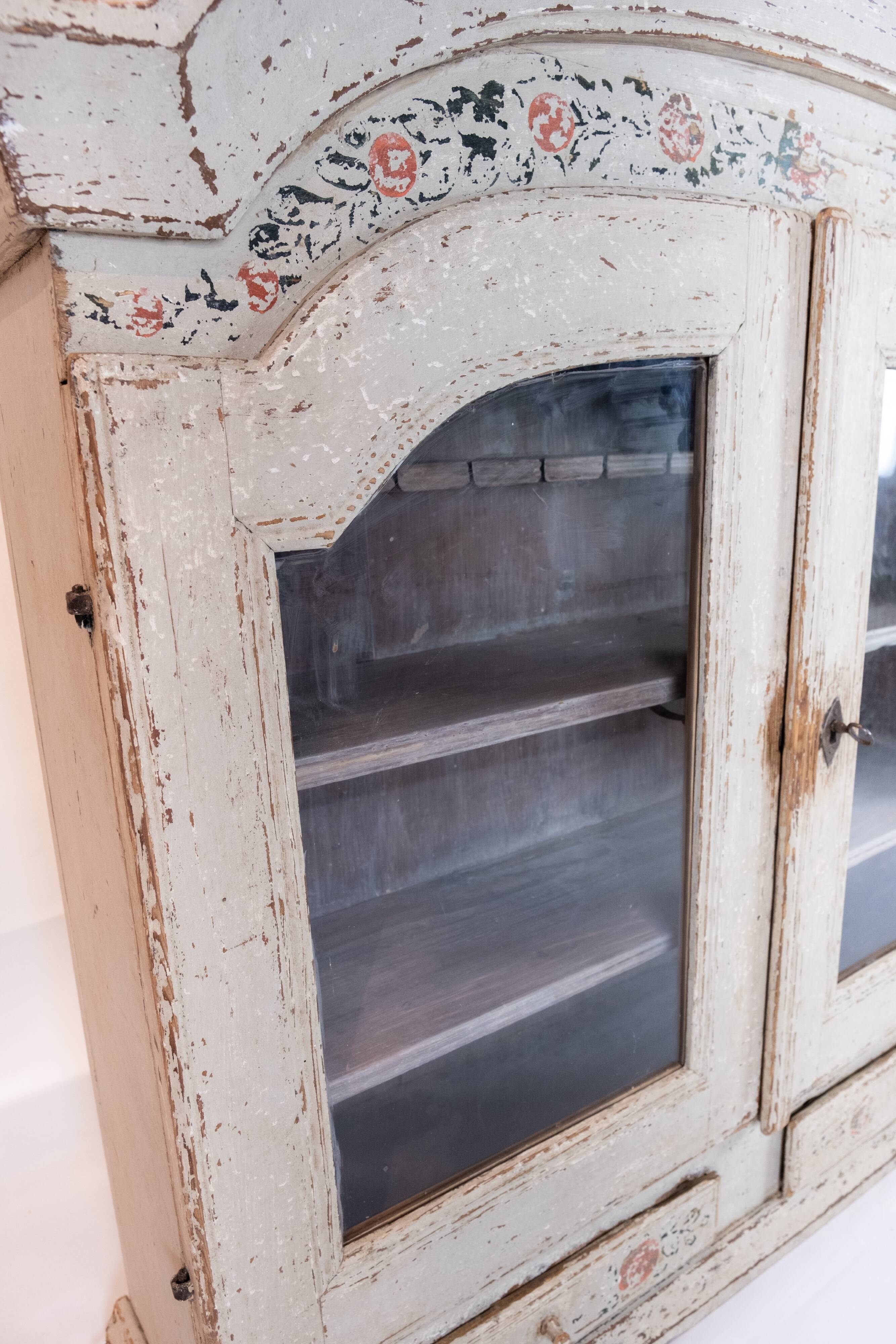 Grey painted hanging glass cabinet in gustavian style from around 1820