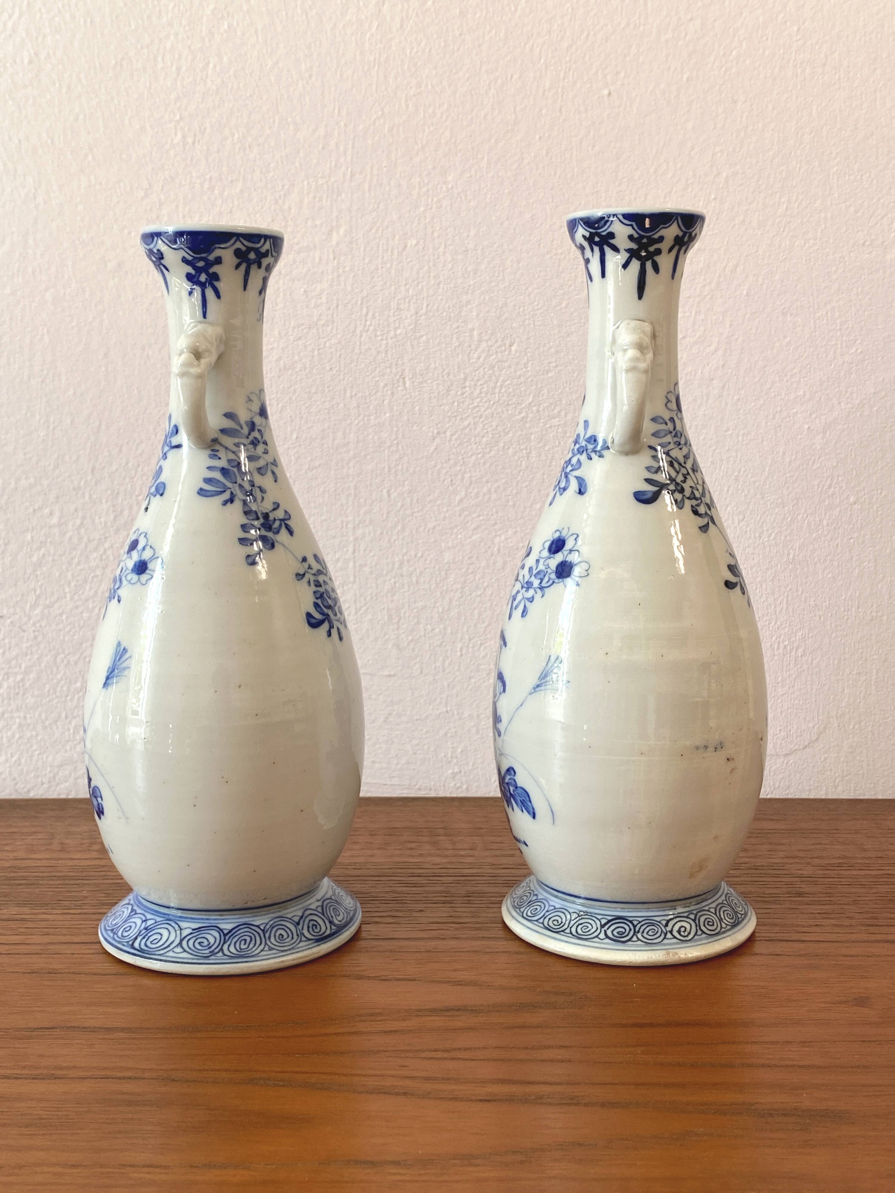 Old pair of blue and white porcelain vases from Japan - in good condition.