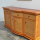 Vintage rattan & wood orange curved sideboard, 1980s