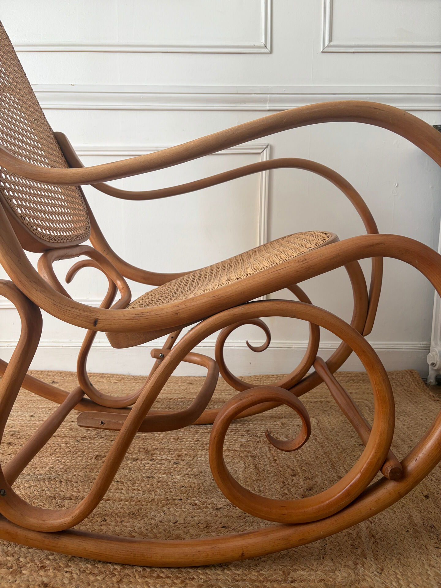 Curved wooden rocking chair