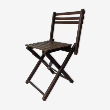 Old folding wooden chair for children