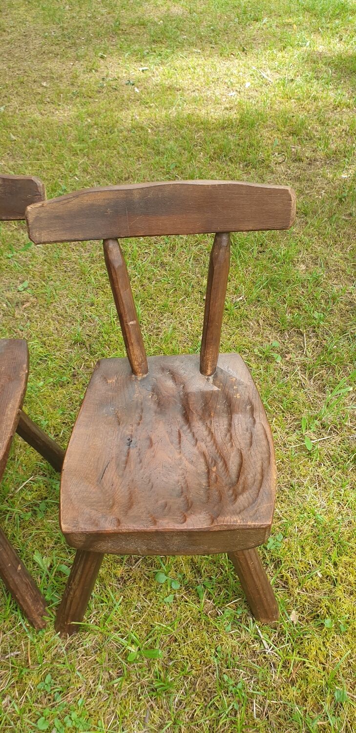 Four chairs and brutalist coffee table
