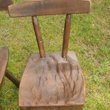 Four chairs and brutalist coffee table