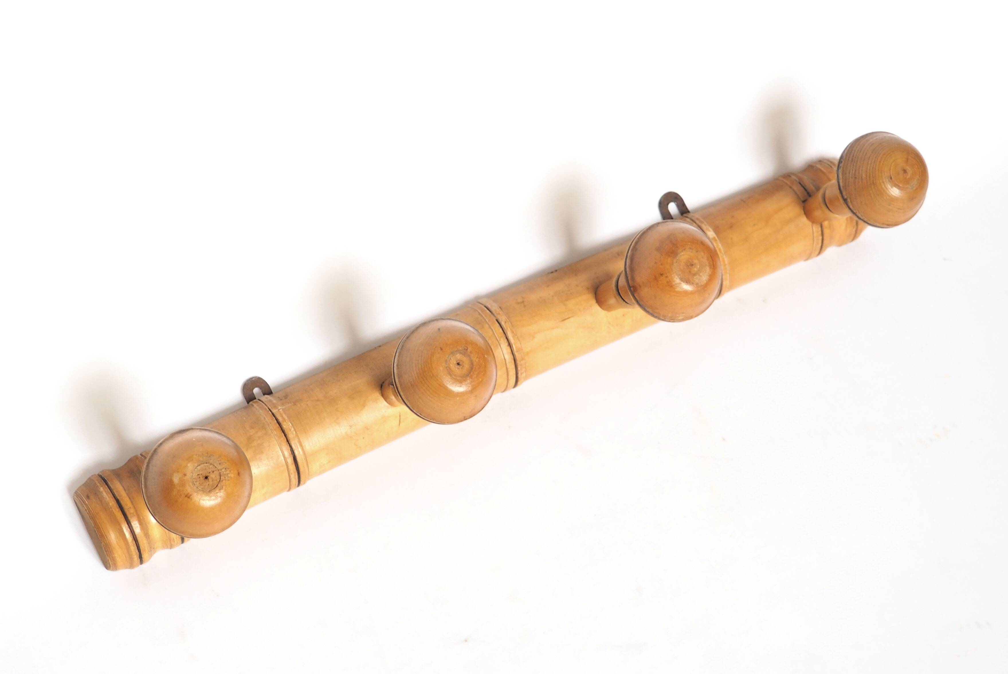 Light wood coat hooks 1900