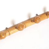 Light wood coat hooks 1900