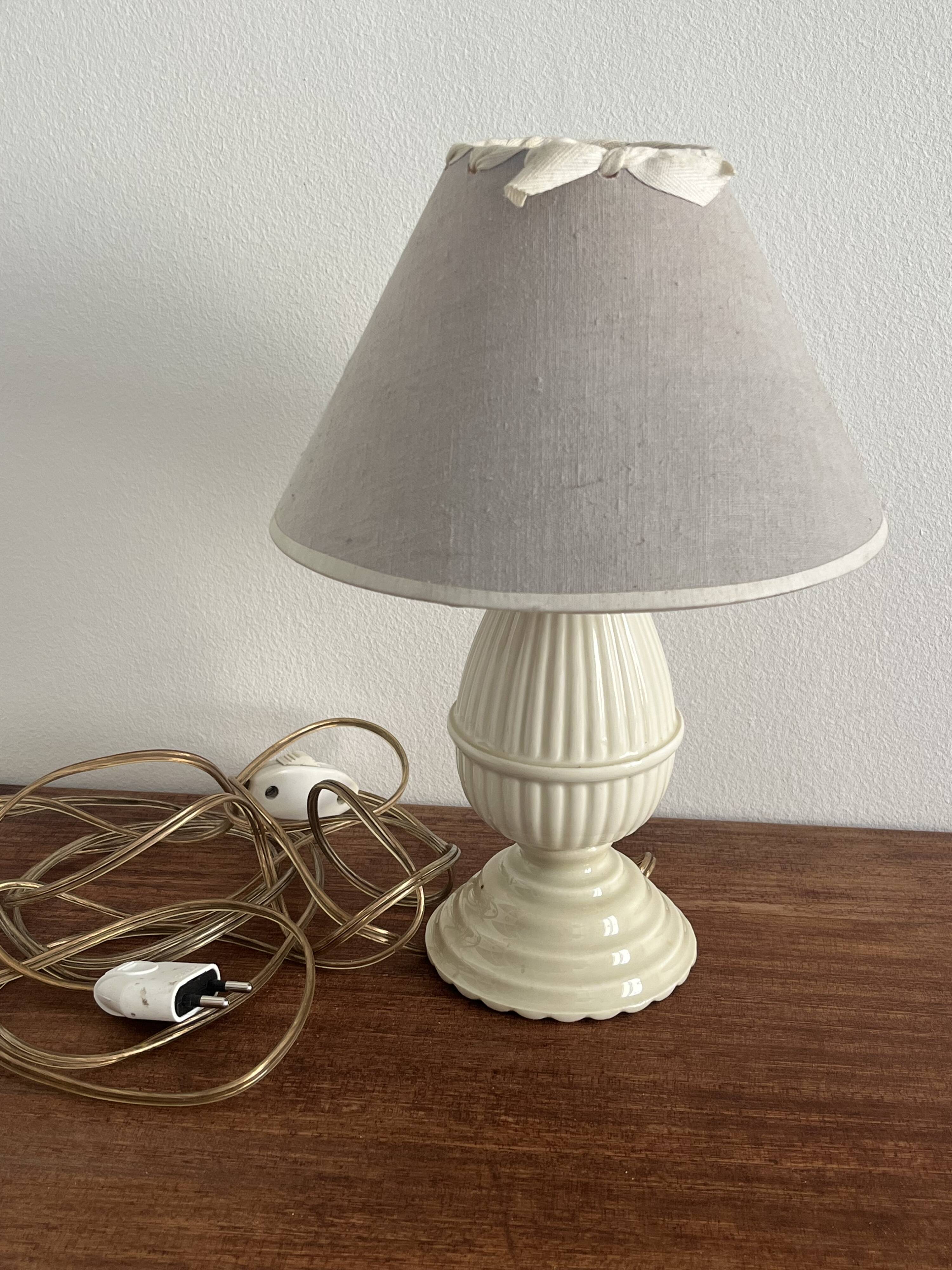 Small bedside lamp in ivory glazed ceramic.