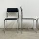 4 chrome metal chairs with black faux leather, 1990
